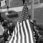 ROTC cadets raising the american flag