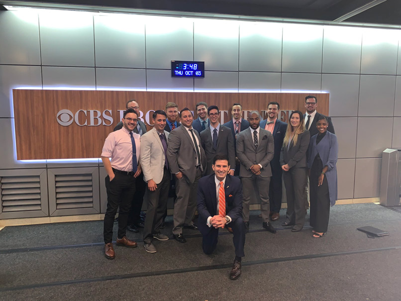 Students during the New York City Career Immersion Trip in fall 2019 at the CBS Broadcast Center. Pictured in photo are Jeff Glor ’97 (center) and Richard M. Jones ’92, G’95, L’95 (kneeling).