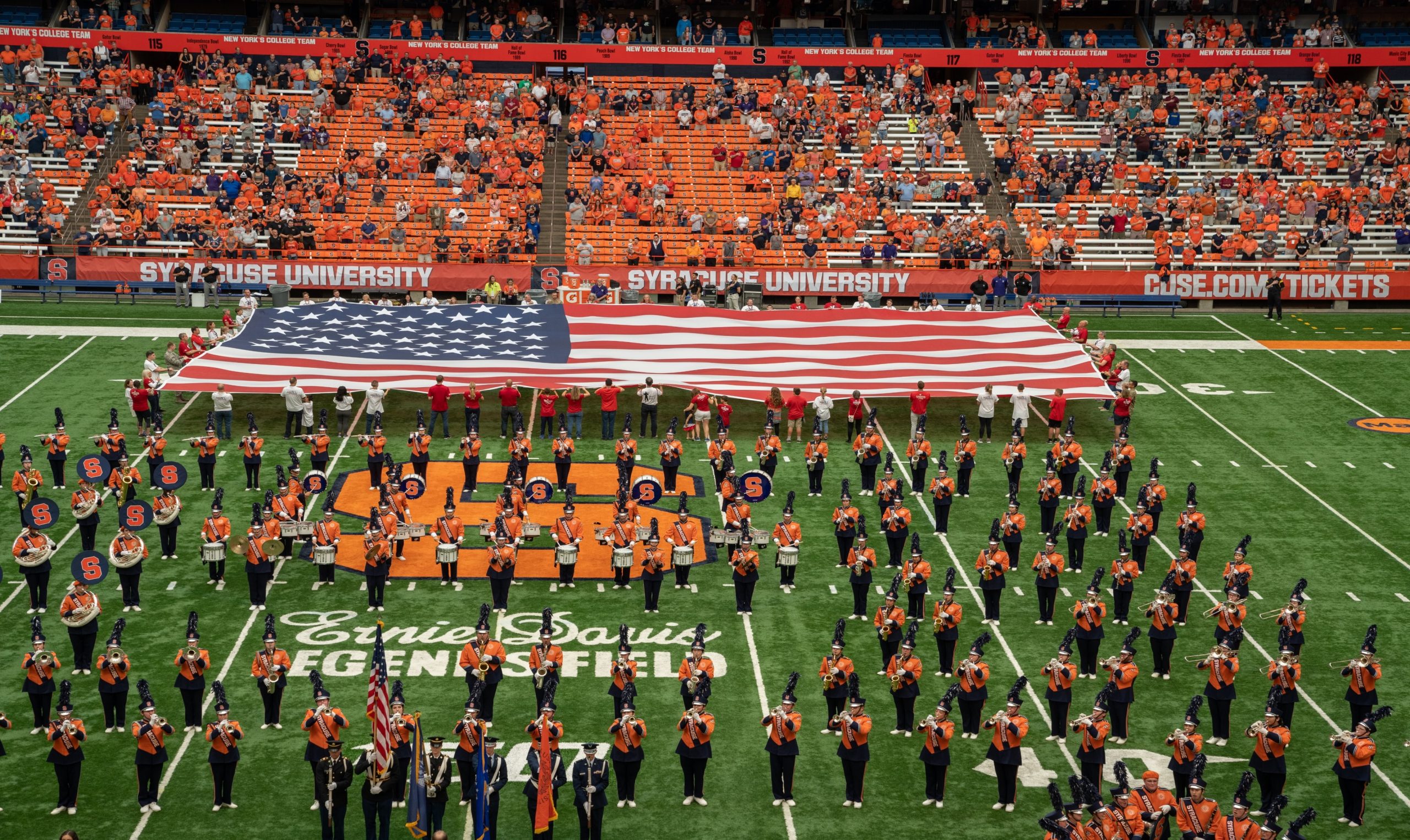 Giant USA Flag on Football field.