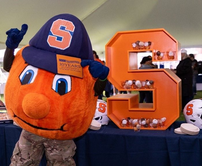 Otto in front of big S at stars and stripes tailgate 2024